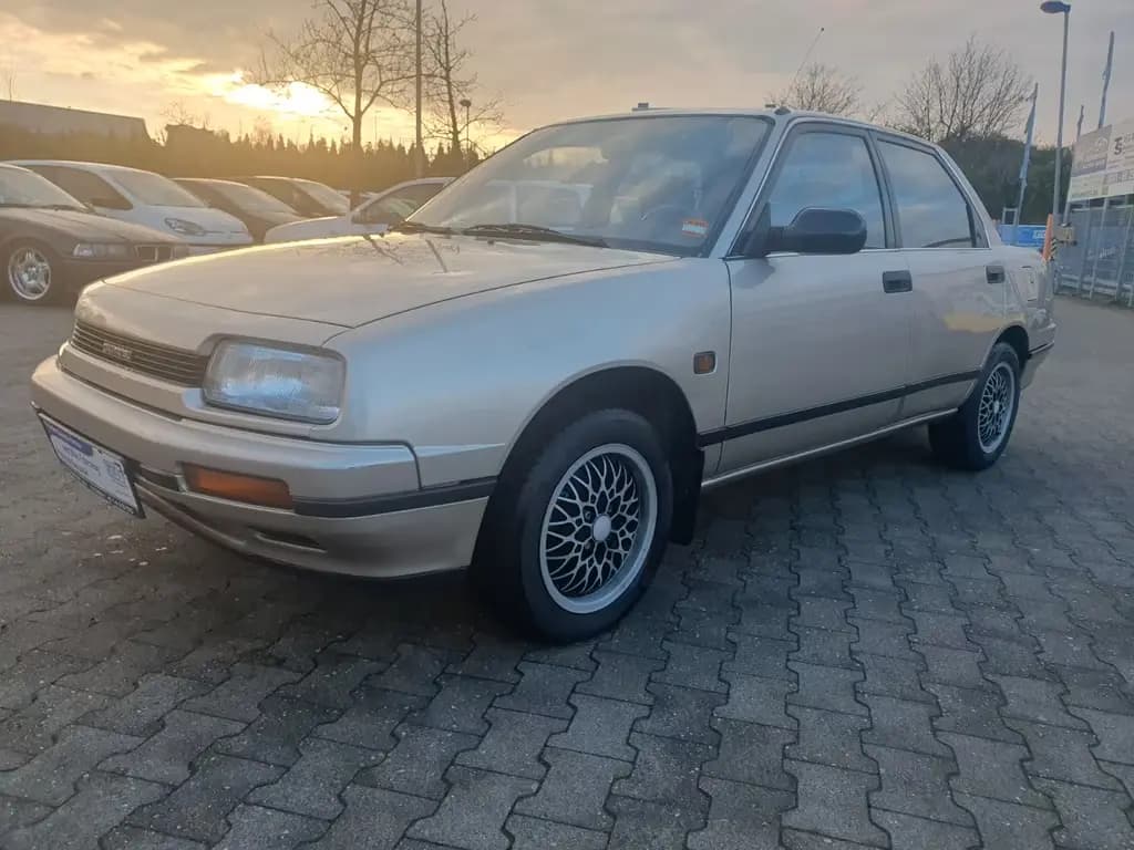 Main__Slider__Photo:Daihatsu Applause 1.6 1 HAND erst 87158 km H-KENNZEICHEN 04/1990-0