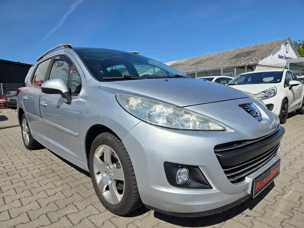 Main__Slider__Photo:Peugeot 207 SW Premium*AHK*Klima*PDC*Pano*Automatik 08/2010-1