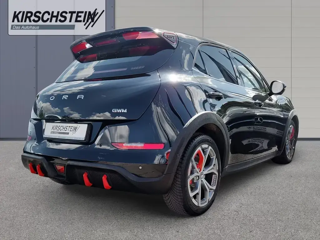 Main__Slider__Photo:GWM ORA 03 GT Starry Black Allwetterreifen Pano Mass 08/2023-1